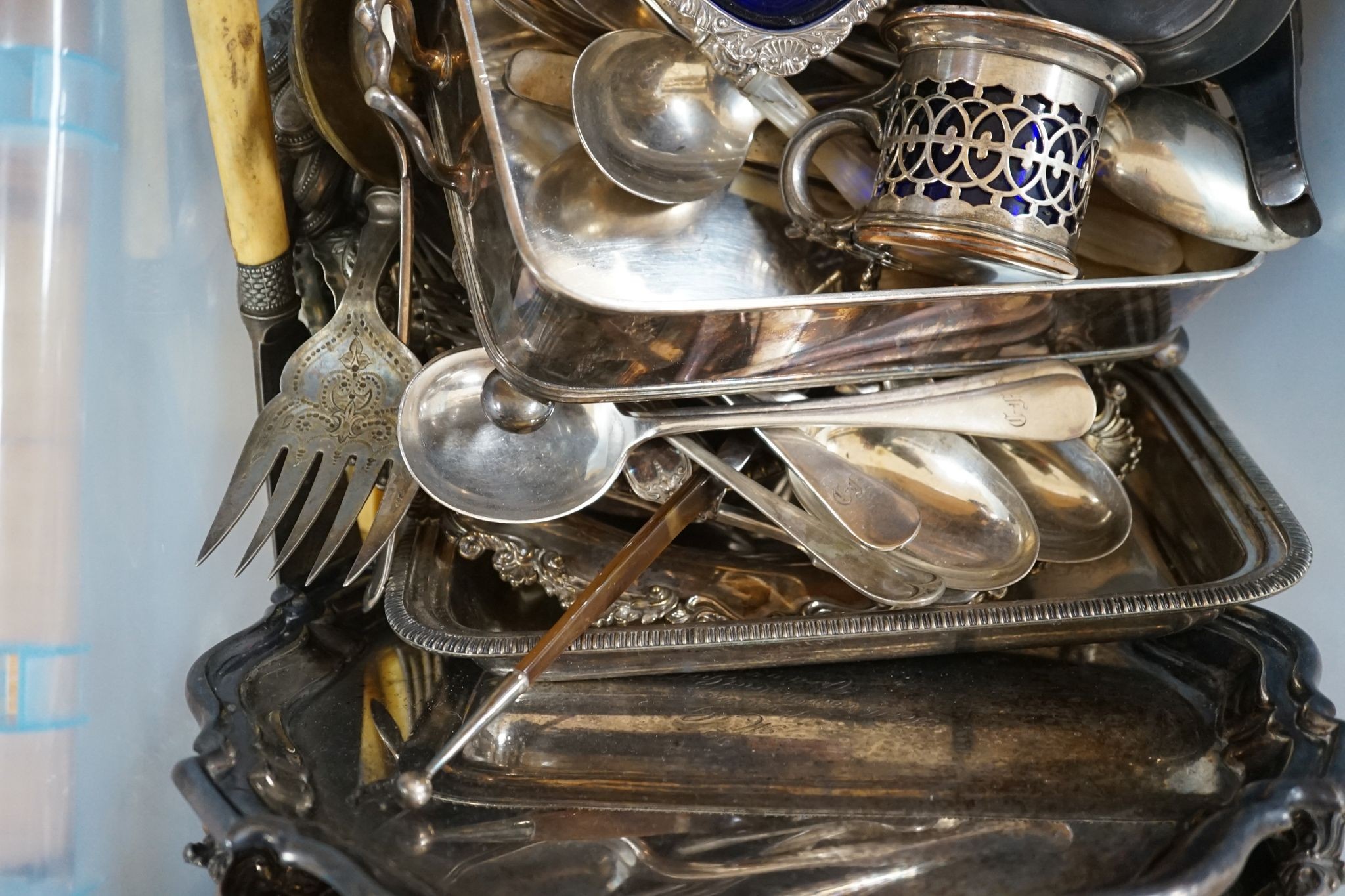 A group of plated wares to include two salvers, mustard pots etc.